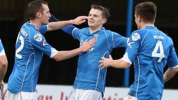 Dungannon striker Paul McElroy celebrates scoring against Warrenpoint