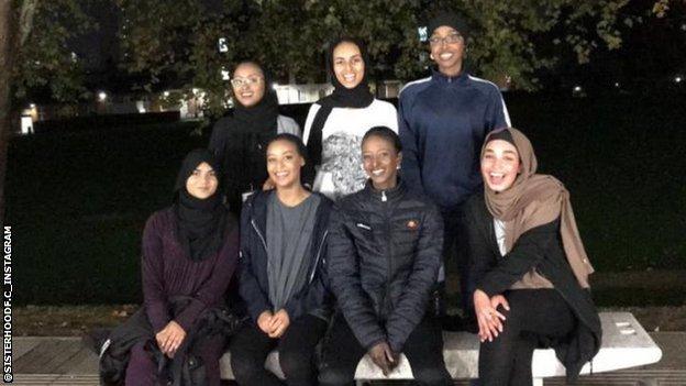 Members of Sisterhood FC pose for a photo