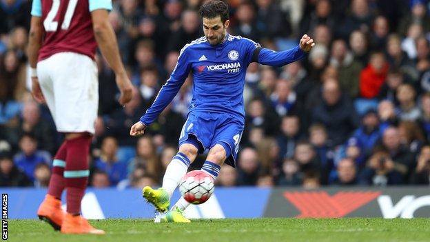 Cesc Fabregas scores from a free-kick