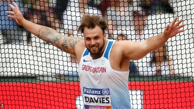 Aled Davies celebrates his gold medal