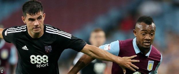 Brentford's John Egan (left) in action against Aston Villa