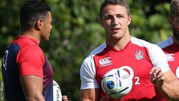 Sam Burgess (right) talks to Luther Burrell at England training