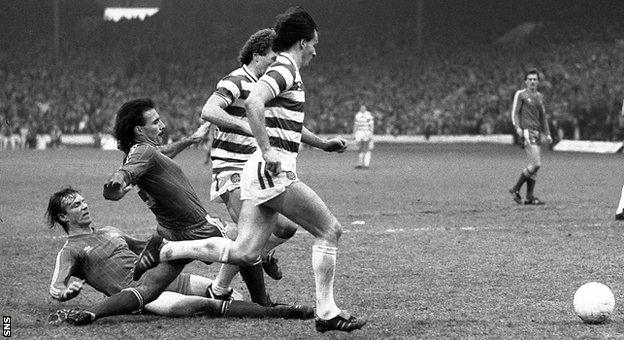 Aberdeen defenders Alex McLeish and Willie Miller slide in to tackle Celtic's Davie Provan and Charlie Nicholas.