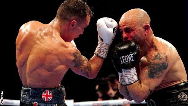 Josh Warrington hits a bloodied Kiko Martinez