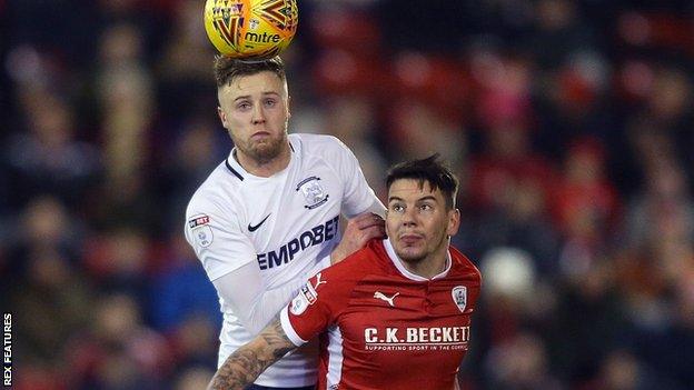 Kevin O'Connor and Adam Hammill battle for the ball