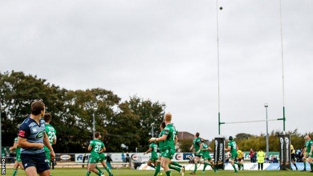 Jarrod Evans (left) watches as his winning conversion goes between the posts in Galway