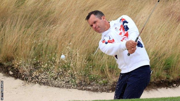 Paul Casey playing out of a bunker in GB Olympics kit