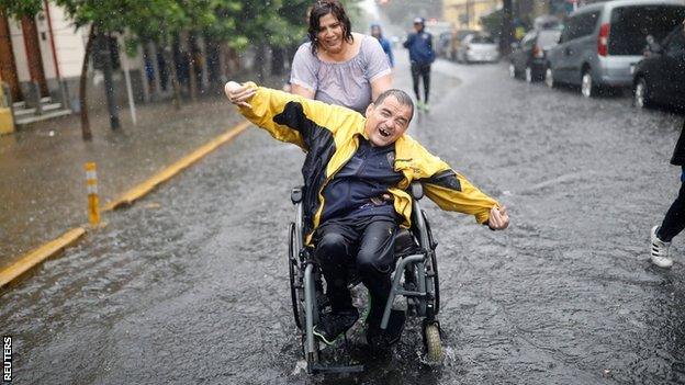 Boca Juniors fan in the rain