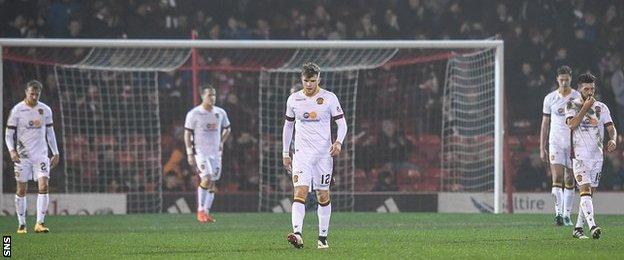 Motherwell players are left dejected