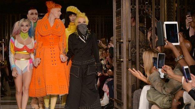 Fashion designer Pam Hogg walking down the catwalk with her models after her show at Fashion Scout during London Fashion Week