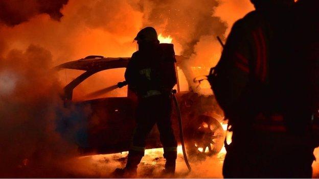 Firefighters tackle car blaze