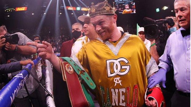 Saul Canelo Alvarez points to the crowd after winning a fight