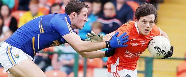 Wicklow's Paul McLoughlin tackles Orchard defender James Morgan