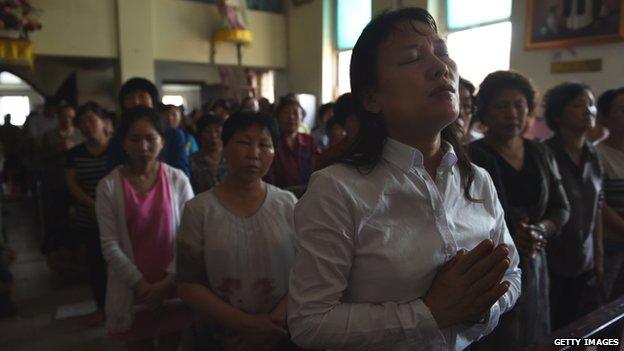 Chinese Catholics attend a mass