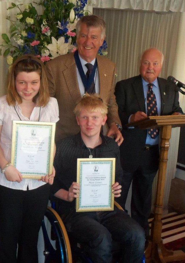 Maxim Lowe and Siobhan Hare pose for photos at the PHAB award ceremony with Ed Stewart