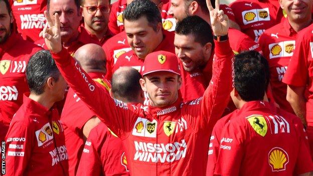 Charles Leclerc (centre) gestures during a group photo session at the Yas Marina Circuit in Abu Dhabi