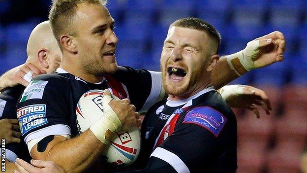 Salford's Lee Mossop celebrates his try against Wigan