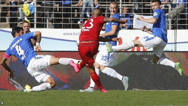 Arturo Vidal scores Bayern Munich's opening goal against SV Darmstadt