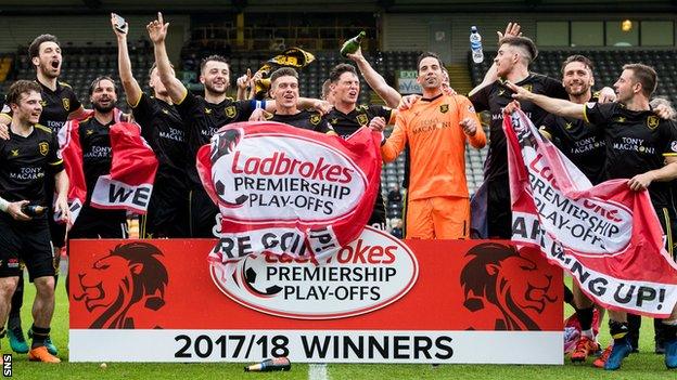 Livingston players celebrate winning the Premiership play-off final