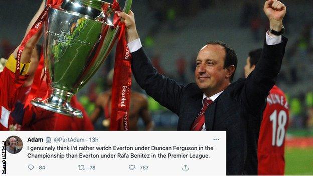 Rafael Benitez holds up Champions League trophy.