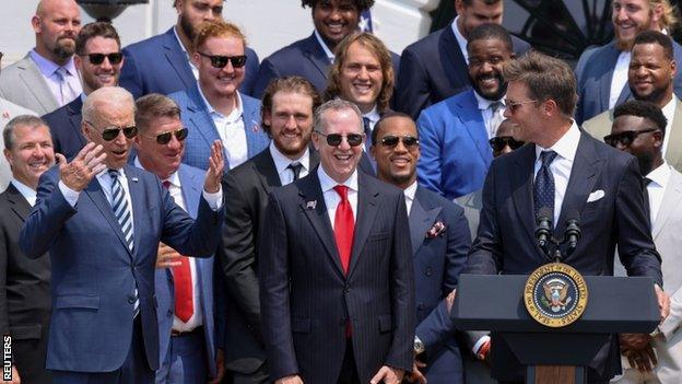 US president Joe Biden reacts to a quip from Tampa Bay Buccaneers quarterback Tom Brady during a reception for the NFL champions at the White House