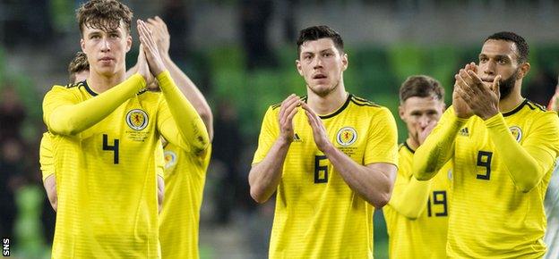 Jack Hendry, Scott McKenna and Scotland goal hero Matt Phillips salute the fans at full time