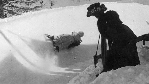 A woman races down the Cresta Run in the early part of the 20th Century