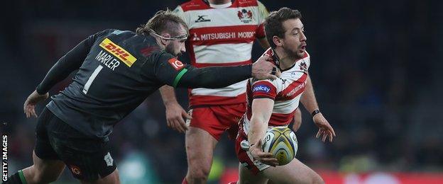 Greig Laidlaw of Gloucester evades Harlequins' Joe Marler