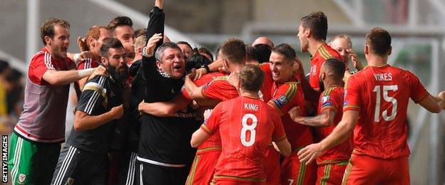 The Wales team and management celebrate in Cyprus