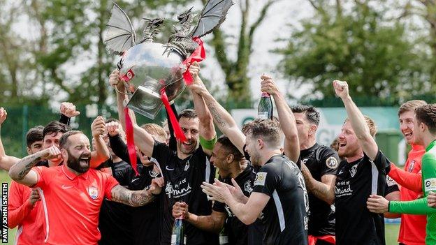 Connah's Quay players celebrate after clinching the Cymru Premier title at Penybont