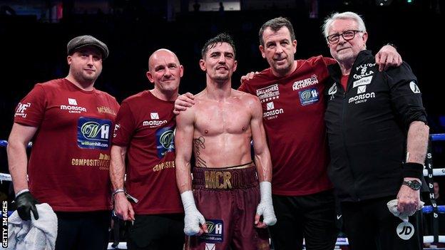 Anthony Crolla poses with his team in the ring after his final win