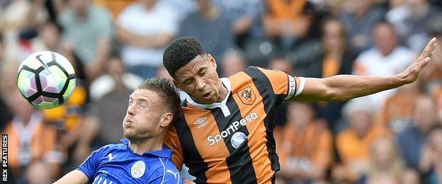 Hull defender Curtis Davies wins a header against Jamie Vardy