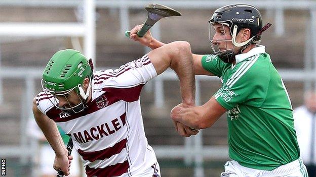 Slaughtneil's Chrissy McKaigue attempts to burst away from Ballygalget's Declan McManus