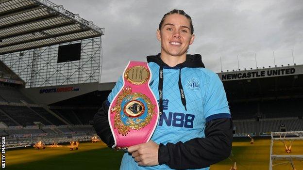 Savannah Marshall holds her WBO title