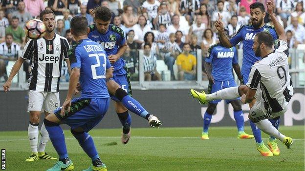 Juventus forward Gonzalo Higuain scores against Sassuolo