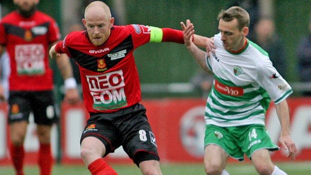 Newtown captain Matthew Cook (left) in action against The New Saints