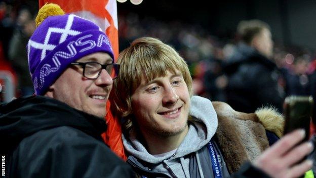 Paddy Pimblett posing with a fellow Liverpool fan for a selfie at Anfield