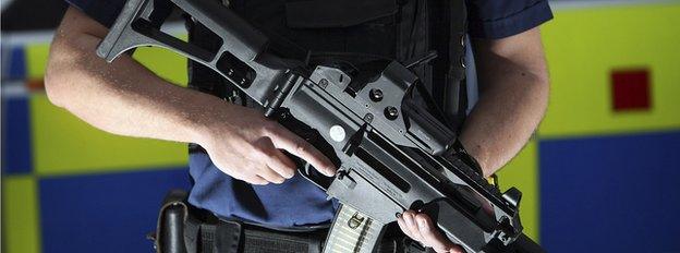 An armed response officer from Greater Manchester Police poses with a Heckler and Koch G36 assault rifle