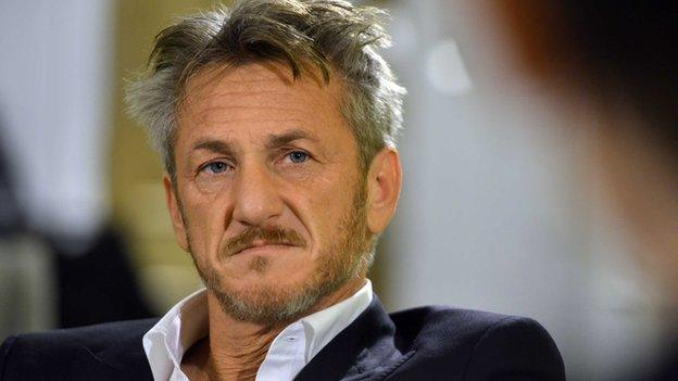 Sean Penn as he looks at someone during a discussion