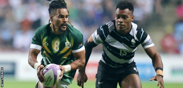 Selvyn Davids of South Africa in action against Vuiviwa Naduvalo of Fiji