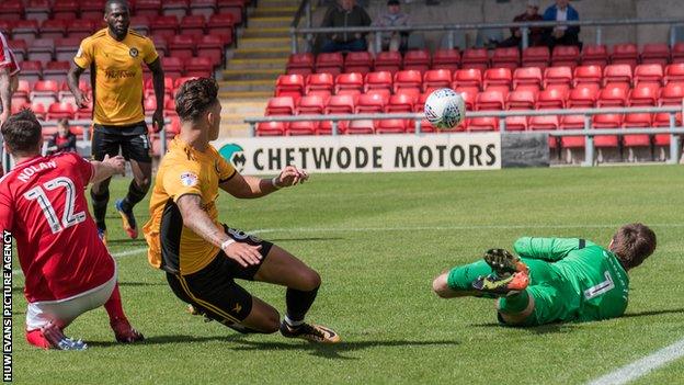 Newport County midfielder Ben White sees his shot saved by Crewe Alexandra goalkeeper Ben Garratt