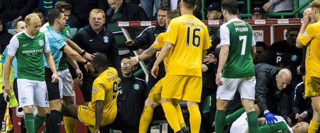 Hibernian and Morton players and managers become involved in a melee