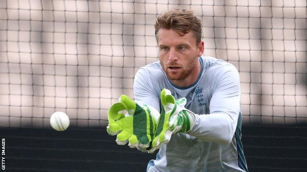 England captain and wicketkeeper Jos Buttler prepares to catch a ball in training