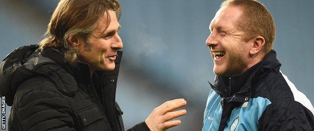 Gareth Ainsworth (left) shares a joke with assistant Richard Dobson