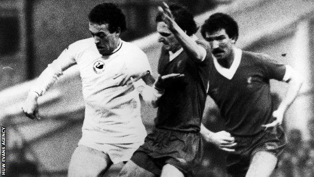 Swansea's Alan Curtis battles Liverpool's Phil Thompson as Graeme Souness looks on in a First Division clash in 1981-82