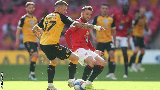 Newport County's Scot Bennett and Morecambe's Aaron Wildig