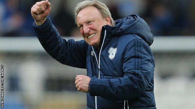 Neil Warnock celebrates post patch