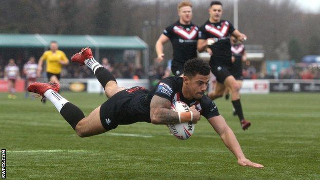 Kieran Dixon scores London's third try against Wigan