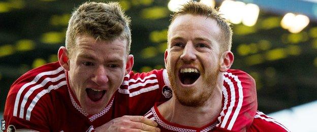 Jonny Hayes (left) and Adam Rooney