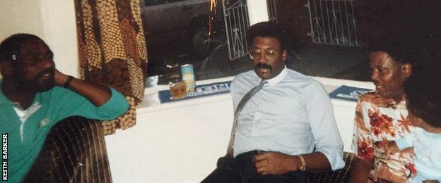 An infant Keith Barker is cradled by his dad, on a night when he had two famous visitors to his front room, former Windies captains Viv Richards and Clive Lloyd